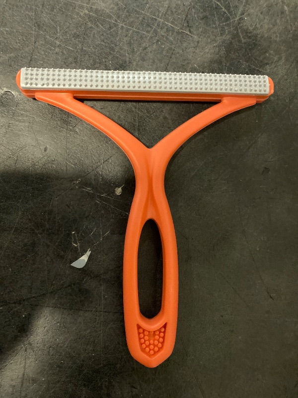 Photo 1 of Manual Lint & Pet Hair Remover, Portable Fabric Fuzz Cleaner and Fur Removal Brush for Clothes, Carpets, Furniture, and Car Seats – Reusable Hair Removal Tool for Home and Pets (Orange)