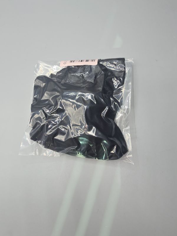 Photo 1 of Black Mesh Skirt & a Black Lace-Trimmed Stocking