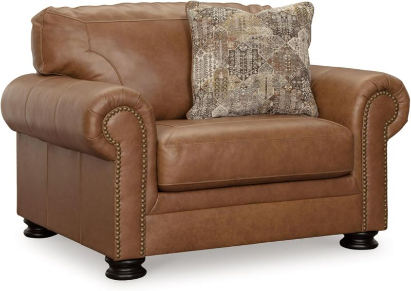 Photo 1 of Dark Brown Signature Design by Ashley Carianna Contemporary Leather Match Upholstered Oversized Chair with Nailhead Trim and 1 Accent Pillow