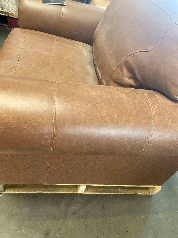 Photo 1 of Dark Brown Signature Design by Ashley Carianna Contemporary Leather Match Upholstered Oversized Chair with Nailhead Trim and 1 Accent Pillow
