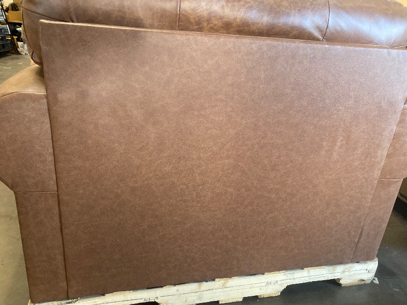 Photo 1 of Dark Brown Signature Design by Ashley Carianna Contemporary Leather Match Upholstered Oversized Chair with Nailhead Trim and 1 Accent Pillow