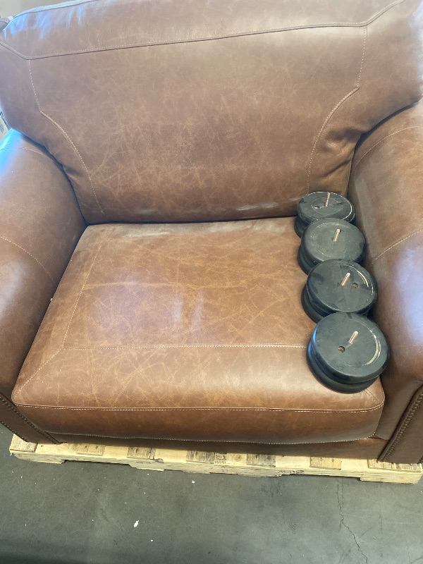 Photo 1 of Dark Brown Signature Design by Ashley Carianna Contemporary Leather Match Upholstered Oversized Chair with Nailhead Trim and 1 Accent Pillow