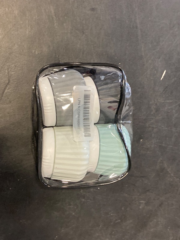Photo 1 of Travel Containers for Toiletries 4 Pack, TSA Approved Travel Size Toiletries, Travel Size Containers, With Clear Bag Leak Proof Silicone Jars, Travel Essentials Creams Jars Carrying Small Items