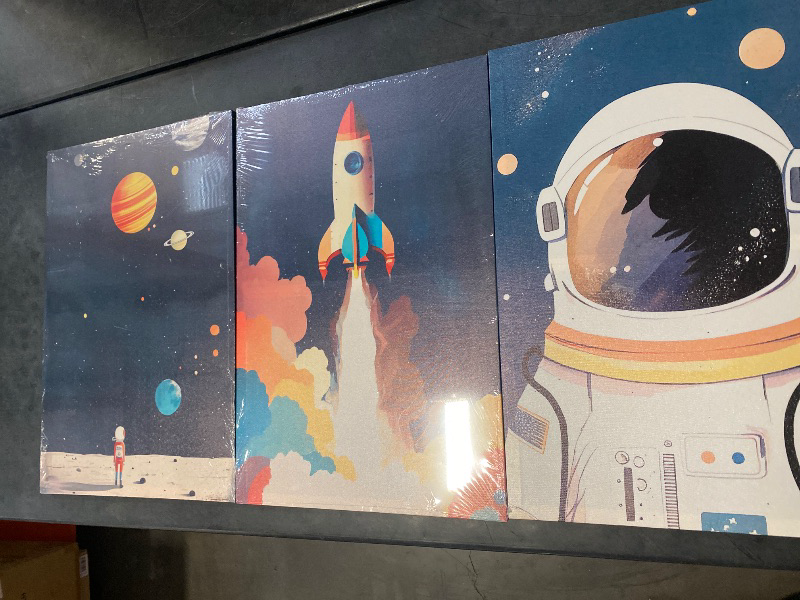 Photo 1 of 3Pcs Astronaut Wall art Nursery Space Adventure Posters Prints Rocketship Wall Decor Explore Dream Galaxy Canvas Prints Funny Planet Painting for Boys Girls Kids Bedroom Living Framed