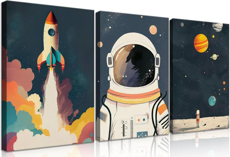 Photo 1 of 3Pcs Astronaut Wall art Nursery Space Adventure Posters Prints Rocketship Wall Decor Explore Dream Galaxy Canvas Prints Funny Planet Painting for Boys Girls Kids Bedroom Living Framed