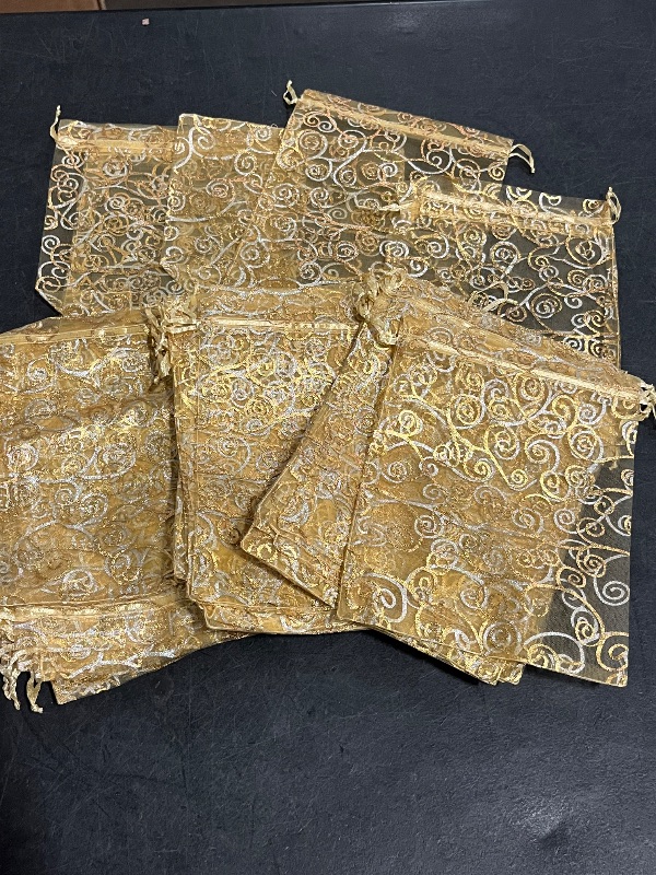 Photo 1 of Staruby Organza Gift Bags 100Pcs Gold Sheer Organza Bag 4x6 Inch Mesh Favor Bags Drawstring Jewelry Rattan Printed Gift Pouches for Wedding Party Favors Couple Shower Christmas Gifts Candy Bags
