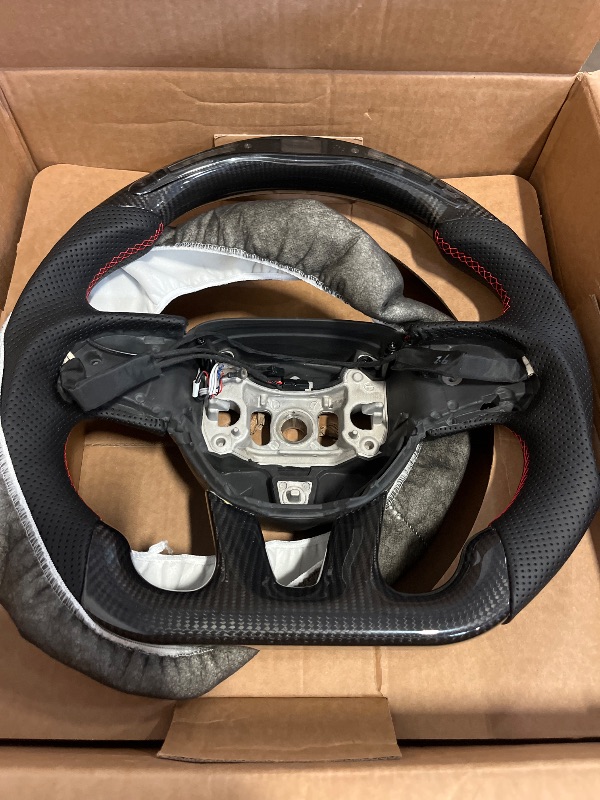 Photo 1 of Real Carbon Fiber Steering Wheel Red Stitching For Dodge Charger/Challenger/SXT/GT/RT/SRT/Heallcat D-shaped LED Shift Indicator Nappa Perforated Leather Flat-bottom Steering Wheel-With Heat
