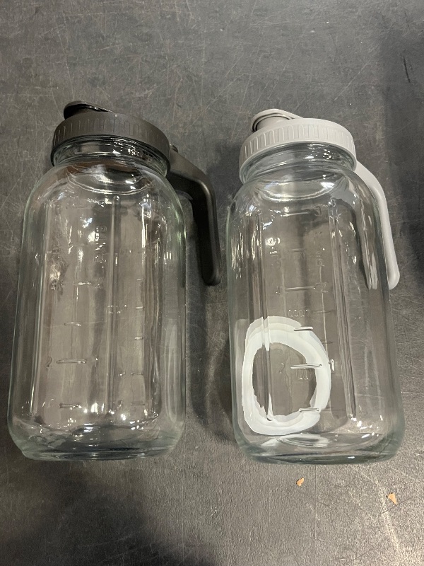 Photo 1 of 64oz Glass Pitchers with Lid and Spout, 2 Quart Mason Jar Pitchers, Wide Mouth Jar Leak-proof Water Jug for Water, Juice, Milk, Tea, Iced Coffee, and Drinks, 2 Packs.