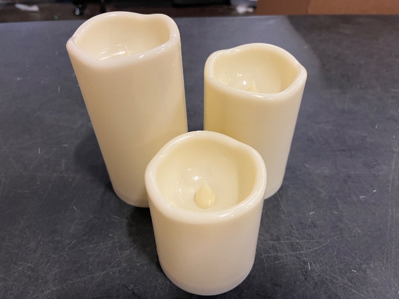 Photo 1 of Flameless Candles 4" 5" 6" Set of 3 Ivory Outdoor Indoor Pillars 3" Diameter Battery Operated Flickering Candles Include 10-Key Remote Timer Function 400+ Hours Requires 2 AA Batteries