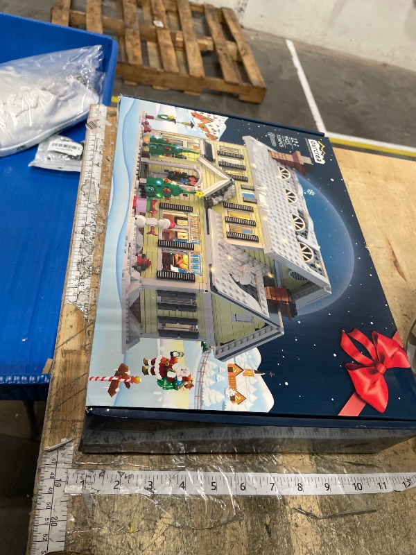 Photo 1 of **FACTORY SEALED** Christmas Holiday House Building Set, LED DIY Christmas Holiday Snow Village, Christmas House Compatible with Lego Gifts for Boys, Girls, Family, and Friends (1156pcs)