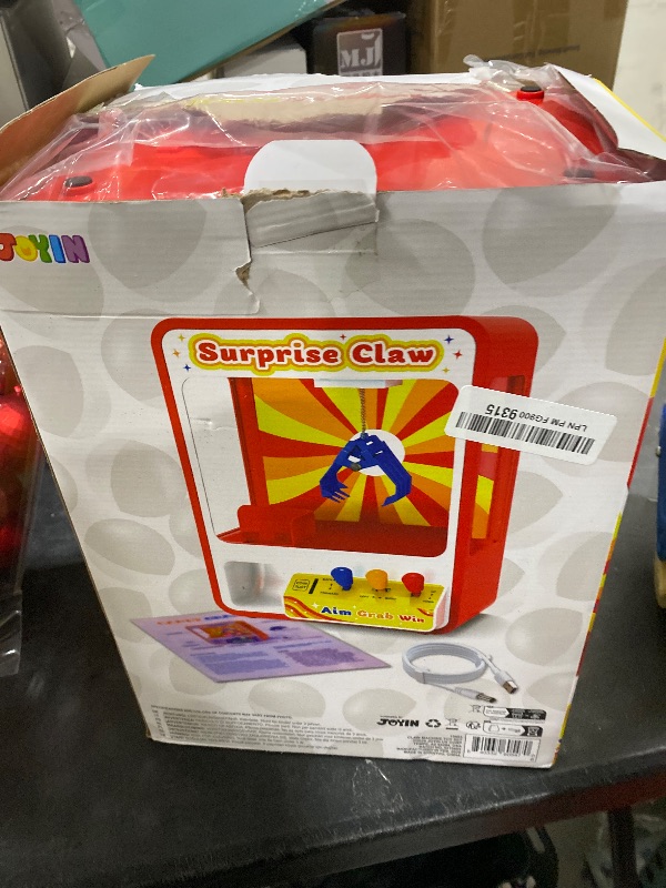 Photo 1 of JOYIN Claw Machine Arcade Toy with LED Light & Adjustable Sound, Rechargable Dispenser Toys Mini Vending Machine for Kids - Perfect Christmas & Birthday Big Gifts for Kids, Ages 3+