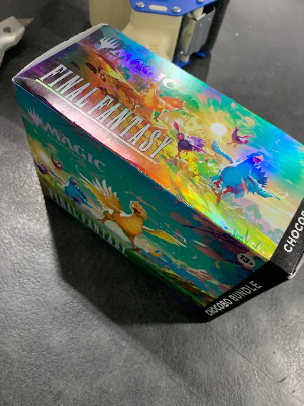 Photo 1 of used-------opened----------------Magic: The Gathering - Final Fantasy Chocobo Bundle (1 Chocobo Booster, 10 Play Boosters, 1 Alt-Art Promo Card, 1 Scene Card, 32 Basic Lands, 1 Click Wheel, and More)
