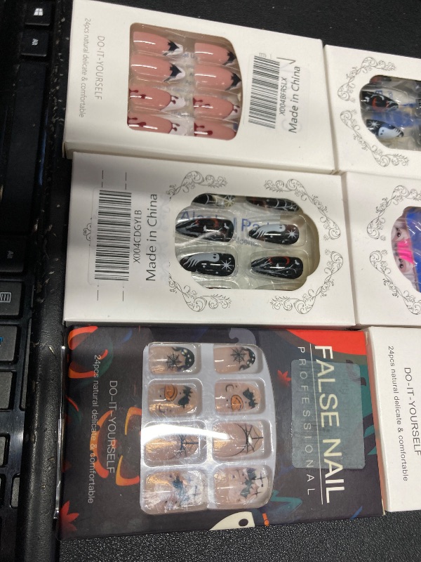 Photo 1 of ***6 ITEMS INCLUDED***Halloween Press on Nails Medium Almond MABKJLF Fake Nails Black False Nails with Designs Ghost Flower Matte Glue on Nail Acrylic Nails for Women Girls 24Pcs***6 ITEMS INCLUDED***