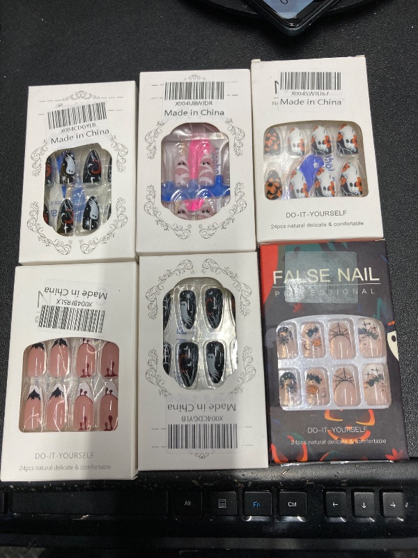 Photo 1 of ***6 ITEMS INCLUDED***Halloween Press on Nails Medium Almond MABKJLF Fake Nails Black False Nails with Designs Ghost Flower Matte Glue on Nail Acrylic Nails for Women Girls 24Pcs***6 ITEMS INCLUDED***