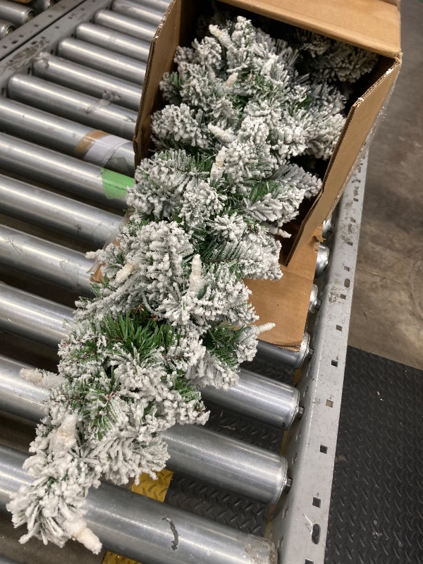 Photo 1 of ***LIGHTS DO NOT WORK***National Tree Company 4 ft Pre-Lit Flocked Downswept Forestree Mini Artificial Christmas Tree,100 Clear Lights, 308 Tips, Metal Plate Base, Green