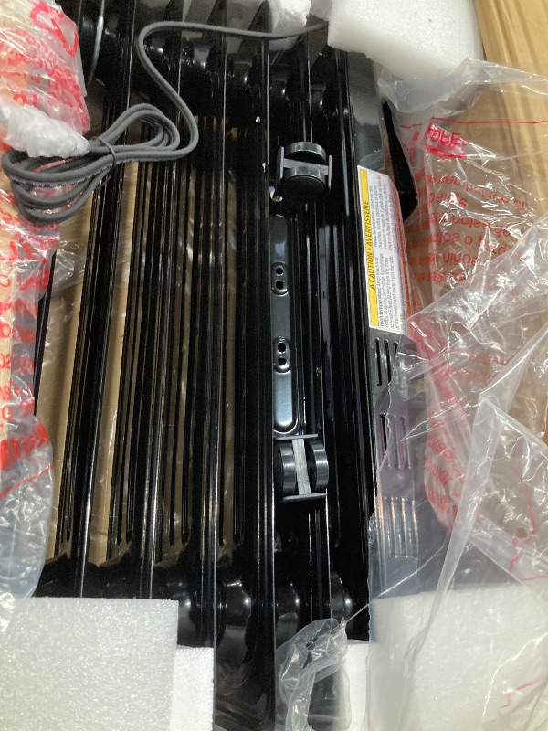 Photo 3 of Amazon Basics Portable Oil Radiator Heater for Indoor Use, 3 Heat Settings, Over-Heat Protection, ETL-certified Safety, 7 Oil-Filled Steel Fins, 1500W, 11"D x 14.8"W x 25.2"H, Black