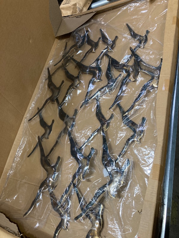 Photo 1 of Deco 79 Metal Bird Home Wall Decor Flying Flock Of Wall Sculpture, Wall Art 48" x 2" x 27", Gold