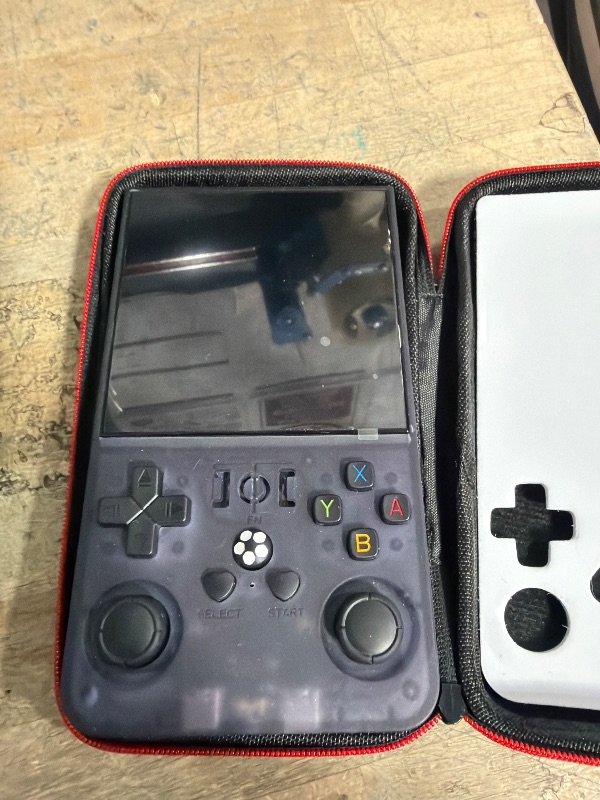 Photo 1 of **MISSING CHARGER**R36MAX Retro Handheld Games Console, Retro Game Console with 4.0 inch IPS HD Screen, Video Game Consoles with 64GB Memory, Portable Gaming Player for Travel, Gift for Teen or Partner, Gray