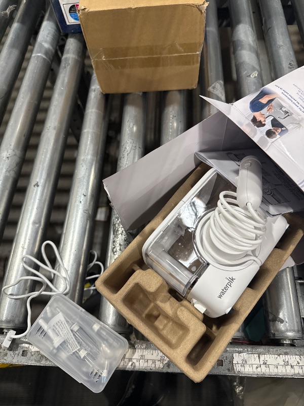 Photo 1 of ***PARTIAL SET - PRICE ADJUSTED***
Waterpik ION Professional Water Flosser, Rechargeable and Portable for Teeth, Gums, Braces, 10 Settings, 7 Flossing Tips For Multiple Users And Needs, ADA Accepted, WF-12 White, Packaging May Vary