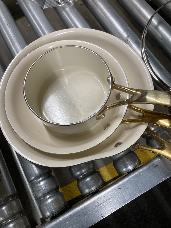 Photo 1 of ***DAMAGE -BENT/DENTED -SELLING AS IS*** Martha Stewart Lockton Premium Non stick Non Toxic PFA Free Ceramic Interior 10 Piece Heavy Gauge Enamel Aluminum Pots and Pans Cookware Set - Linen White w/Gold Handle