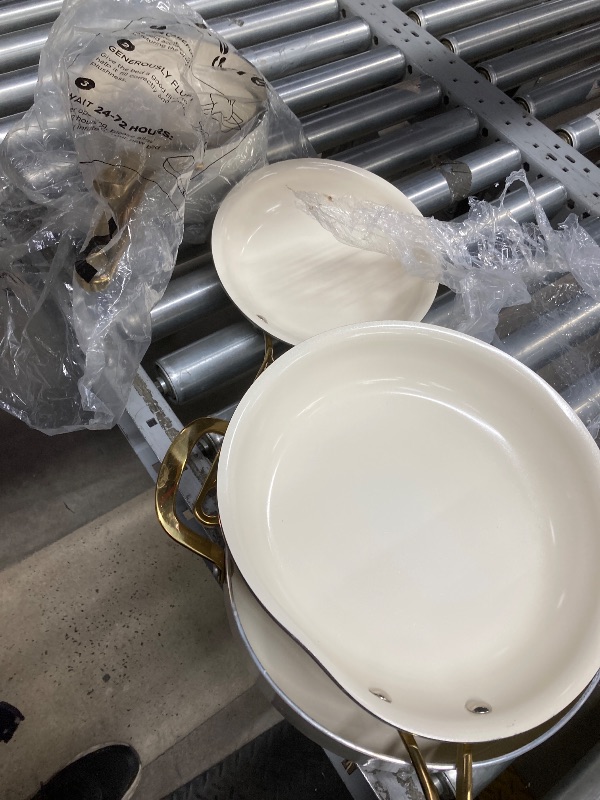 Photo 1 of ***DAMAGE -BENT/DENTED -SELLING AS IS*** Martha Stewart Lockton Premium Non stick Non Toxic PFA Free Ceramic Interior 10 Piece Heavy Gauge Enamel Aluminum Pots and Pans Cookware Set - Linen White w/Gold Handle