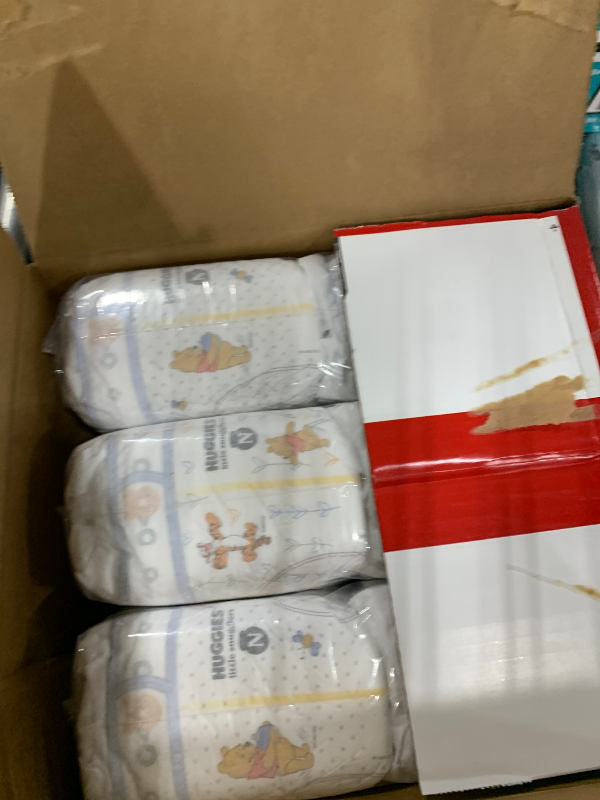 Photo 1 of ****READ NOTES BEFORE BIDDING, OPEN PACKAGES/INCOMPLETE****
Huggies Size Newborn Diapers, Little Snugglers Baby Diapers, Size Newborn (up to 10 lbs), 144 Count, Packaging May Vary