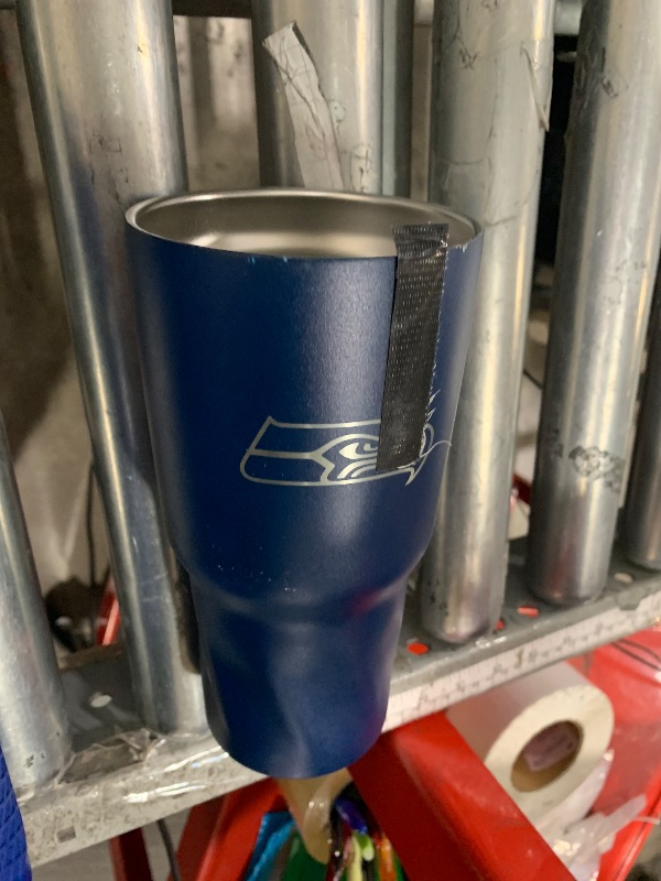 Photo 1 of  Seahawks blue tumbler 30 0z/ damaged no lid