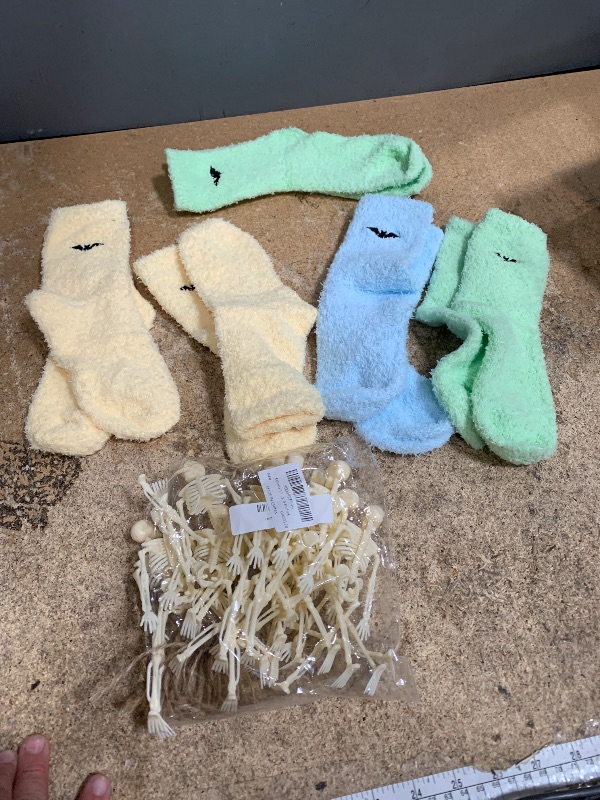 Photo 1 of *****FINAL SALE****NELLIS AUCTION MISCELLANEOUS BUNDLE $15.00
***11 MINI SKELETONS 2 PAIRS OF YELLOW/1 PAIR OF BLUE/2 PAIRS OF GREEN SLIPPER SOCKS***