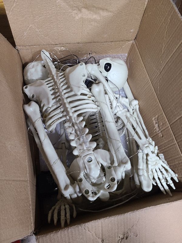 Photo 1 of 2 Pack 39.3 Inches 150 LED Light Up Skeleton Full Body, Posable & Movable Jonints Halloween Skeleton Decor, Battery Powered & Well Made Plastic Skeletons with Light Up Eyes