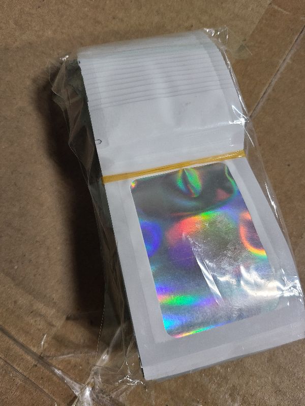 Photo 1 of 100 Pack Holographic Bags, Smell Proof Packaging Bag, Clear Window Resealable Odor Foil Pouch Mylar Bags for Food Storage and Lipgloss, Jewelry Lash (White, 2.4 x 3.9 Inch)
