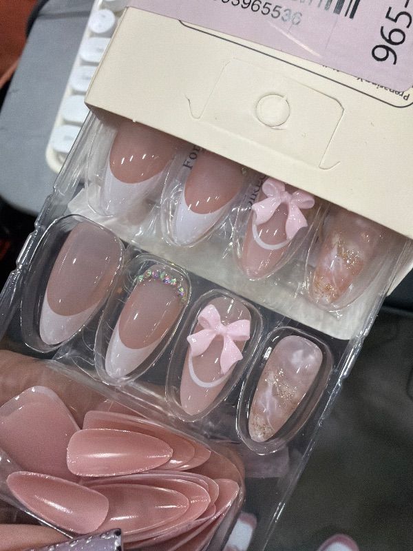 Photo 1 of ***STOCK PHOTO FOR REFERENCE ONLY***
24Pcs White French Tip Press on Nails Short Almond Valentines Day Fake Nails Glitter Stick on Nails 3D Bow Rhinestones Design Nude Nail Tips Full Cover Acrylic Valentine Decor False Nail for Women