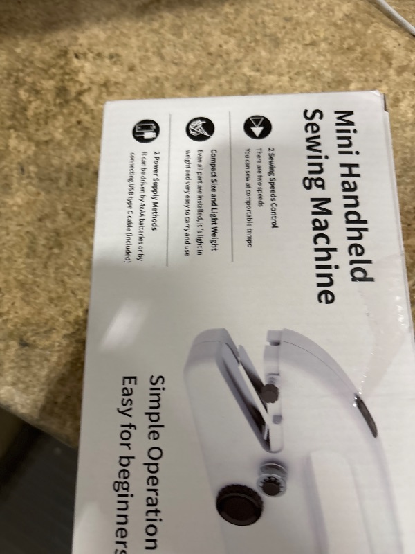 Photo 1 of Mini Handheld Sewing Machine with 8pc Kit & Guide, 2-Speed Portable Electric Sewing Tool for Travel, DIY Crafts, Quick Clothing Repairs and Fixing Hem