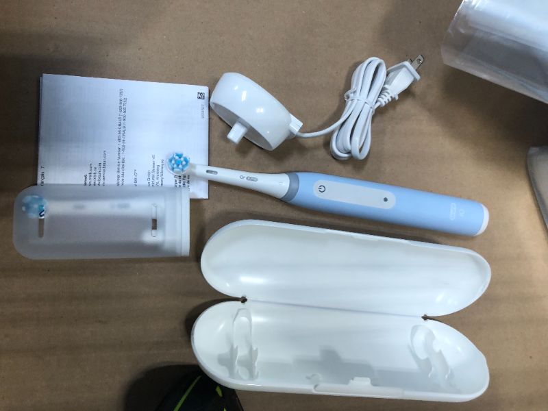 Photo 1 of Oral-B iO Deep Clean Rechargeable Electric Powered Toothbrush, Icy Blue with iO Series 3 Limited, 2 Brush Heads and Travel Case - Pressure Sensor to Protect Gums - 3 Cleaning Settings - 2 Minute Timer
