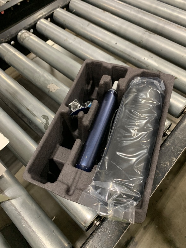 Photo 1 of Oral-B iO Deep Clean + Protect Rechargeable Electric Toothbrush, Black with a iO Series 7 Toothbrush, 2 Replacement Brush Heads, and a Charging Travel Case