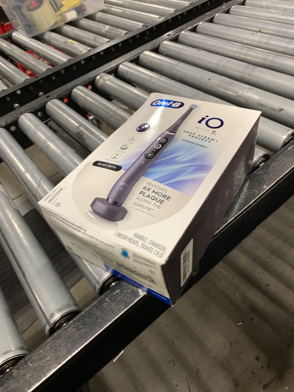 Photo 1 of Oral-B iO Deep Clean + Protect Rechargeable Electric Toothbrush, Black with a iO Series 7 Toothbrush, 2 Replacement Brush Heads, and a Charging Travel Case
