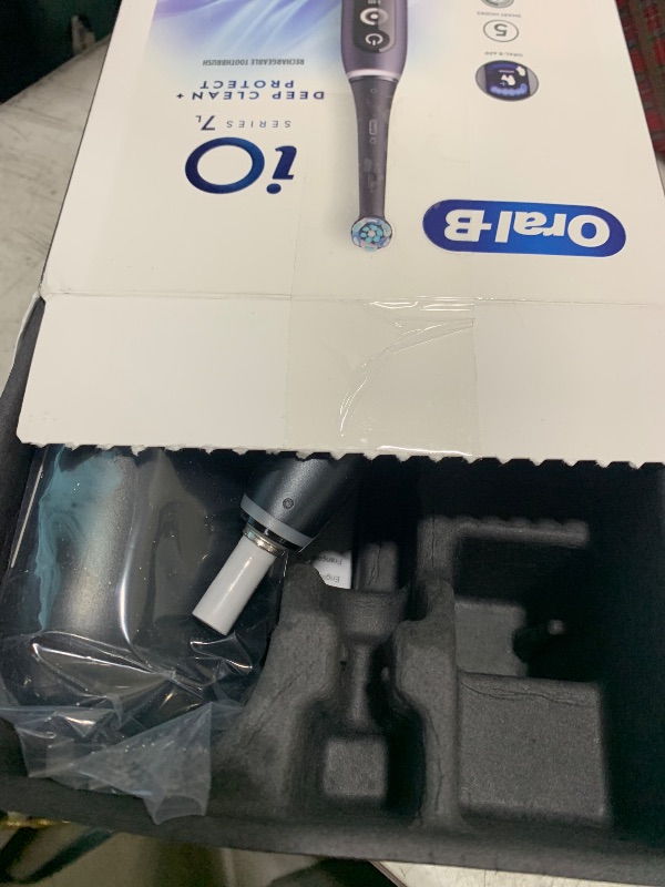Photo 1 of Oral-B iO Deep Clean + Protect Rechargeable Electric Toothbrush, Black with a iO Series 7 Toothbrush, 2 Replacement Brush Heads, and a Charging Travel Case