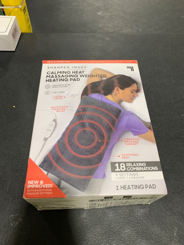 Photo 1 of Calming Heat Massaging Weighted Heating Pad by Sharper Image- Weighted Electric Heating Pad with Massaging Vibrations, 9 Settings- 3 Heat, 6 Massage- 18 Relaxing Combinations, 12” x 24”, 4 lbs