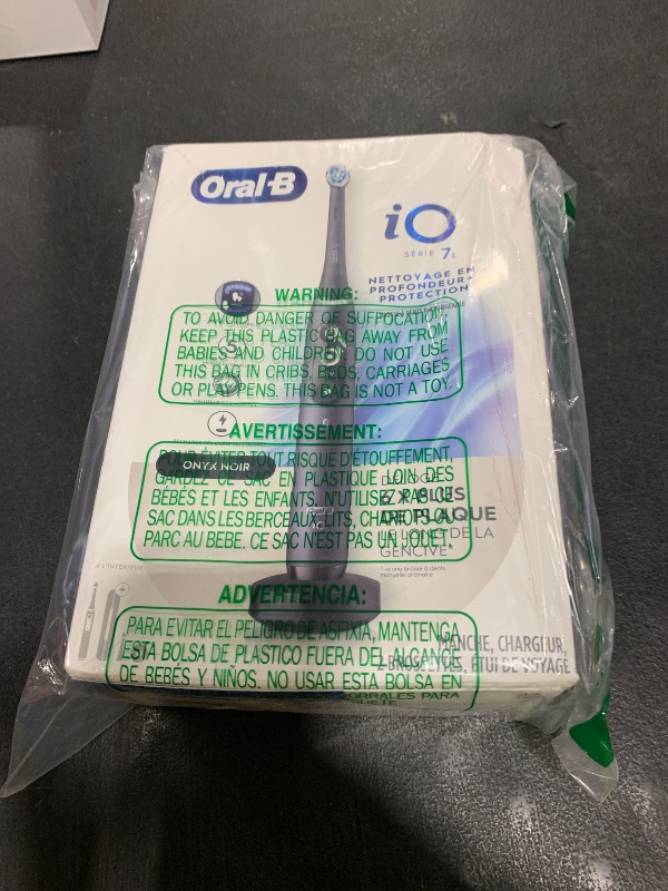 Photo 1 of Oral-B iO Deep Clean + Protect Rechargeable Electric Toothbrush, Black with a iO Series 7 Toothbrush, 2 Replacement Brush Heads, and a Charging Travel Case