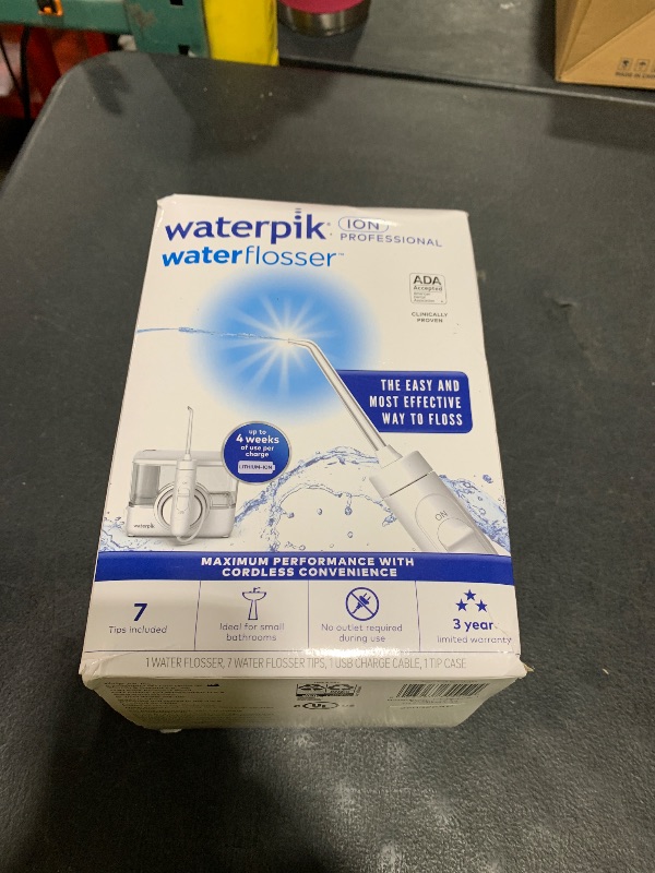 Photo 1 of Waterpik ION Professional Water Flosser, Rechargeable and Portable for Teeth, Gums, Braces, 10 Settings, 7 Flossing Tips For Multiple Users And Needs, ADA Accepted, WF-12 White, Packaging May Vary