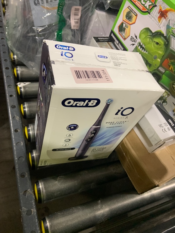 Photo 1 of Oral-B iO Deep Clean + Protect Rechargeable Electric Toothbrush, Black with a iO Series 7 Toothbrush, 2 Replacement Brush Heads, and a Charging Travel Case
