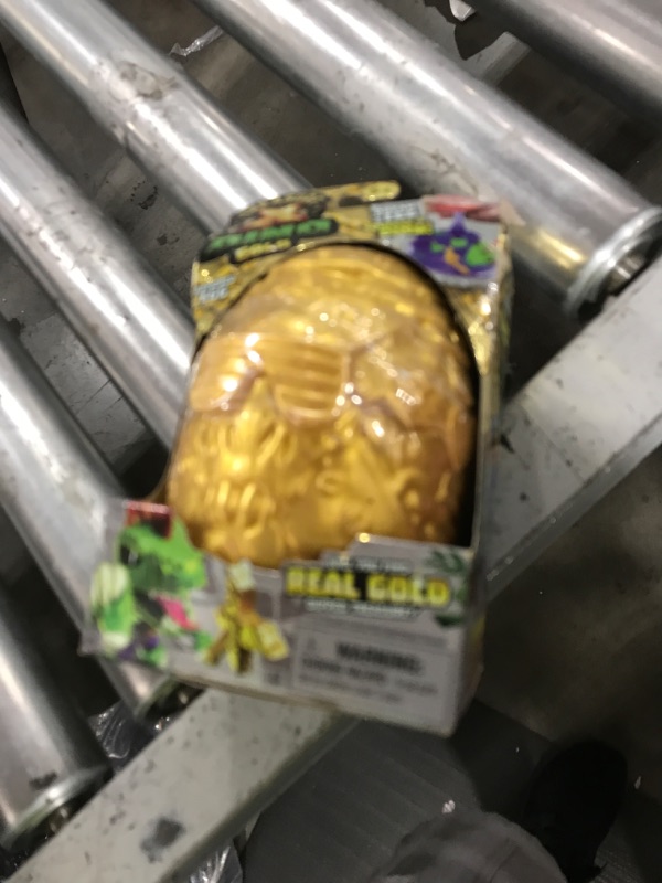 Photo 1 of Treasure X Dino Gold Armored Egg. Break The Egg. Squeeze The Ooze Out. Smash The Fossil to Find The Treasure. Then Build The Dino and Display. Styles May Vary