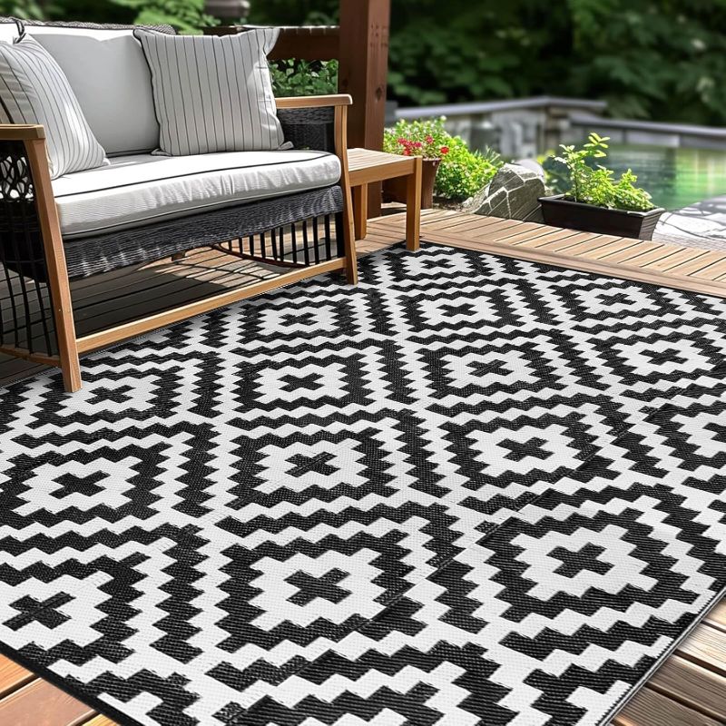 Photo 1 of Outdoor Patio Plastic Straw Rug - 5x8 ft Outdoor Camping Rug Waterproof Reversible, Area Carpet Patios Clearance RV, Outside Porch Balcony Deck for Camper, Black & White