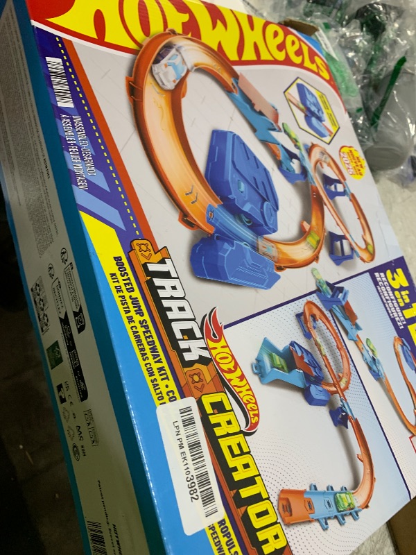 Photo 1 of Hot Wheels Toy Car Track Set, Deluxe Building Box with Motorized Booster, 1:64 Scale Vehicle, Speed Snap Track, Boosted Jump Speedway