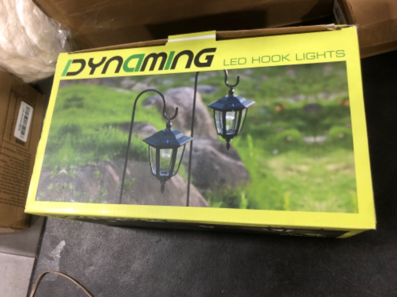 Photo 1 of Dynaming 2 Pack Solar Hanging Lights Outdoor, Solar Powered Garden Decorative Lanterns with 2 x 38 Inch Shepherd Hooks, Waterproof Landscape Lighting for Lawn Patio Yard Pathway Driveway, Warm White