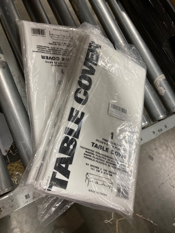 Photo 1 of  pack of 2 Slergut 6 Pack Plastic Table Cloth, White Thick Table Cloth Rectangle Table Cover 54 x 108 Inch Disposable Waterproof Tablecloth for Parties Camping Decoration 