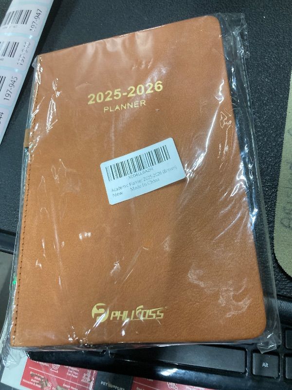 Photo 1 of 2025-2026 Daily Planner, One Page Per Day, Academic Planner (July 2025 - June 2026), Appointment Book with Time Slots and Monthly Tabs, 5.7" x 8.25", Pocket, Leather Cove (Brown)