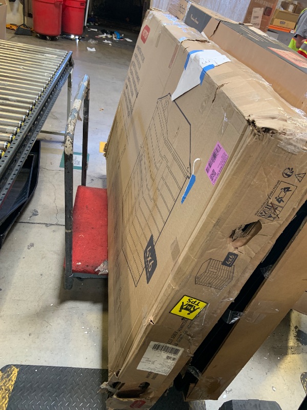 Photo 1 of Keter Manor 4x6 Resin Outdoor Storage Shed Kit-Perfect to Store Patio Furniture, Garden Tools Bike Accessories, Beach Chairs and Lawn Mower, Grey & White