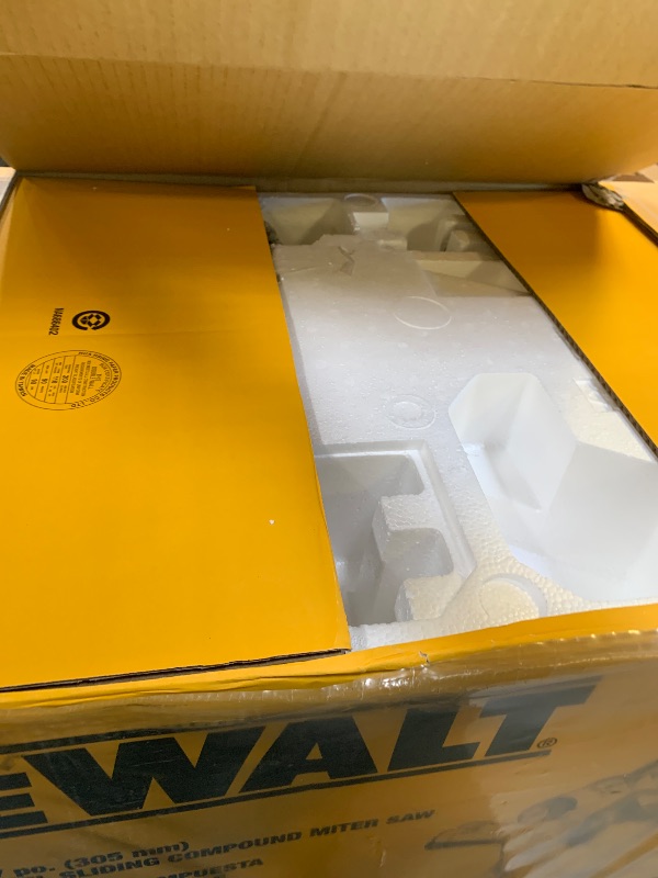Photo 1 of DEWALT Miter Saw, 12-inch Double Bevel Sliding Compound Miter Saw with XPS LED Shadow Light System, Includes Blade Wrench, Material Clamp and Dust Bag (DWS780)