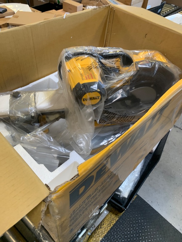 Photo 1 of DEWALT Miter Saw, 12-inch Double Bevel Sliding Compound Miter Saw with XPS LED Shadow Light System, Includes Blade Wrench, Material Clamp and Dust Bag (DWS780)