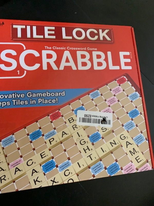 Photo 1 of **USED, INCOMPLETE** Tile Lock Scrabble by Winning Moves Games USA, Innovative Gameboard Locks Tiles in Place, for 2 to 4 Players, Ages 8 and Up
